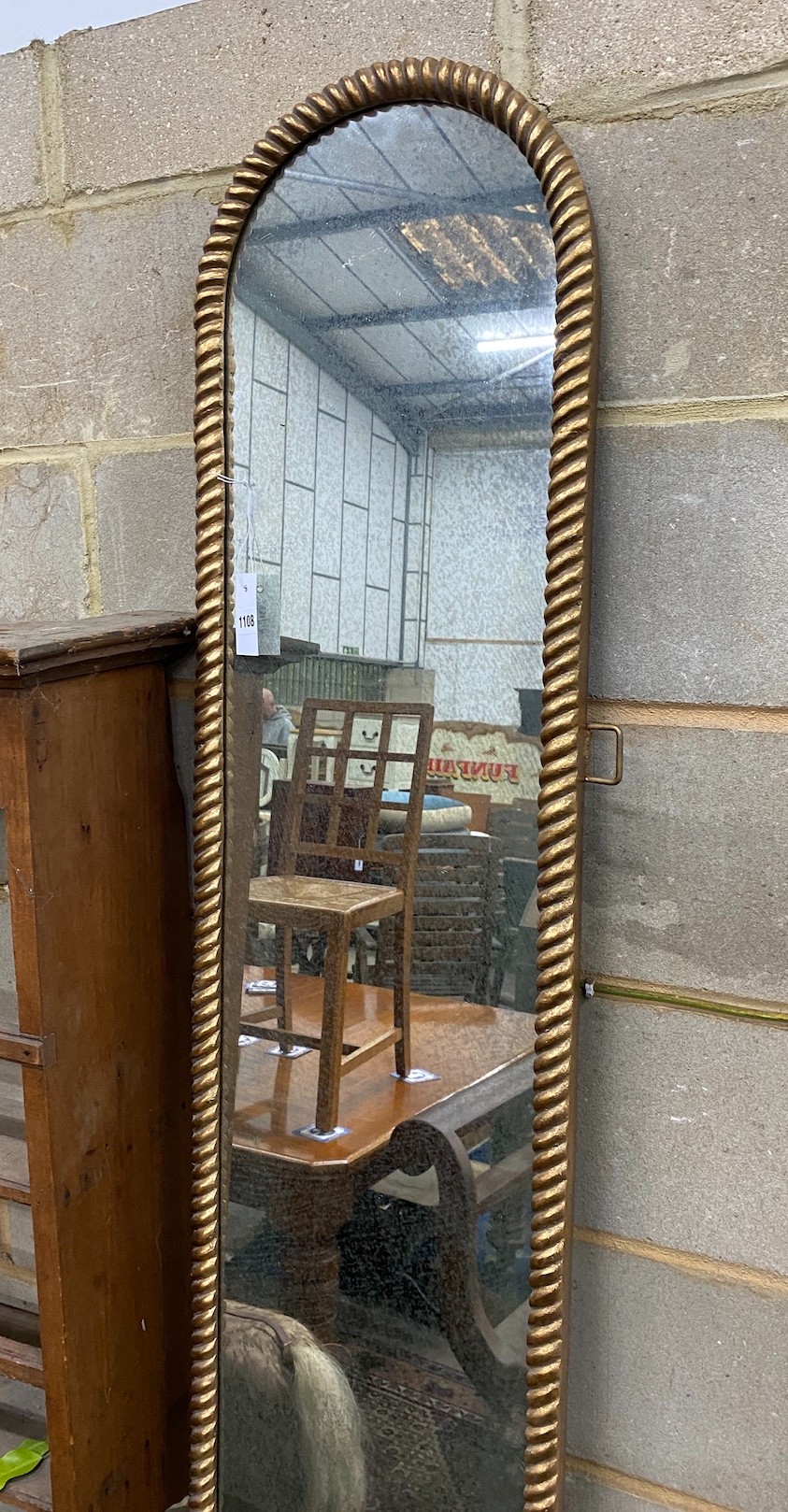 A gilt composition framed wall mirror, width 36cm height 214cm